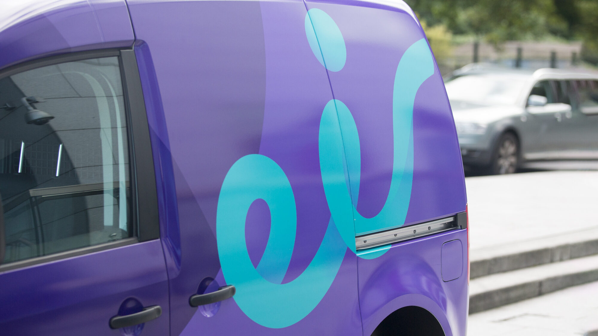 A van with the eir brand logo on the side.